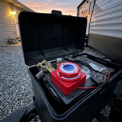 Switch installed on an RV battery parked beside the house