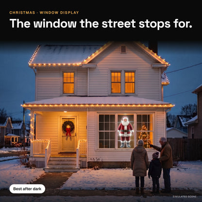 A life-size Santa hologram glows in a front window while grandparents and a child watch from the sidewalk