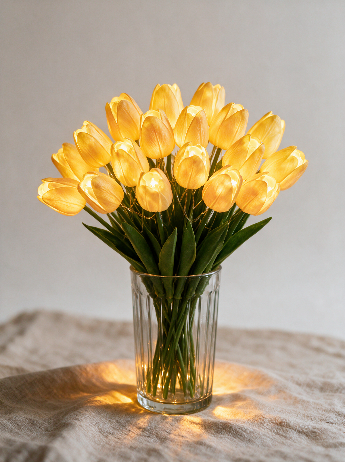 Warm Yellow glowing tulip bouquet, fifteen stems in a ribbed glass vase