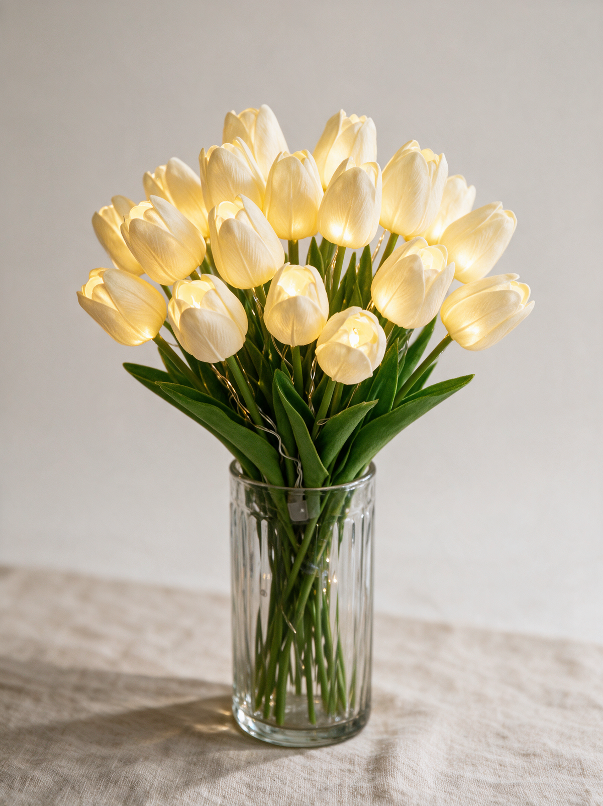 Cream White glowing tulip bouquet, fifteen stems in a ribbed glass vase