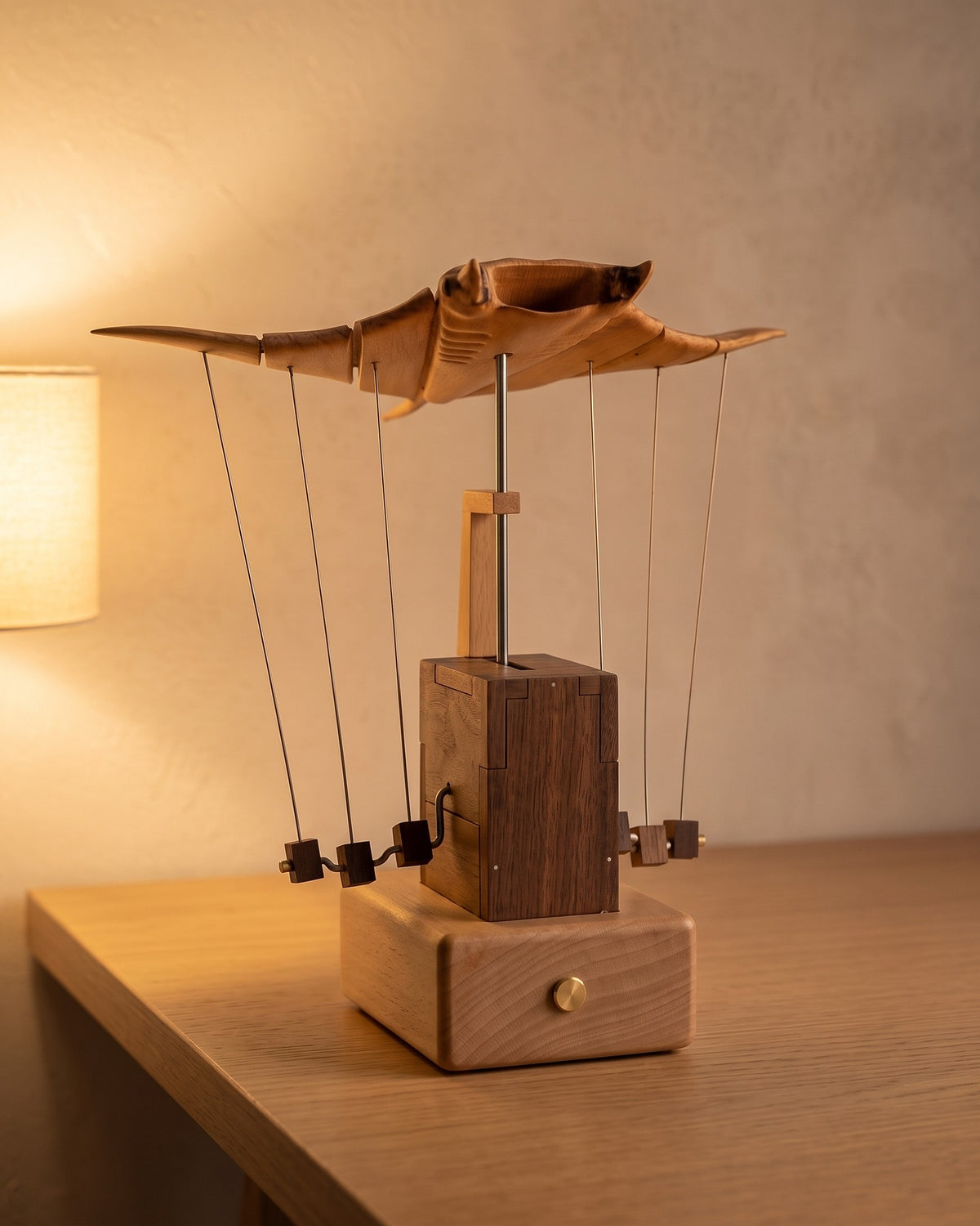 Wooden manta ray in the evening, lit by a warm table lamp