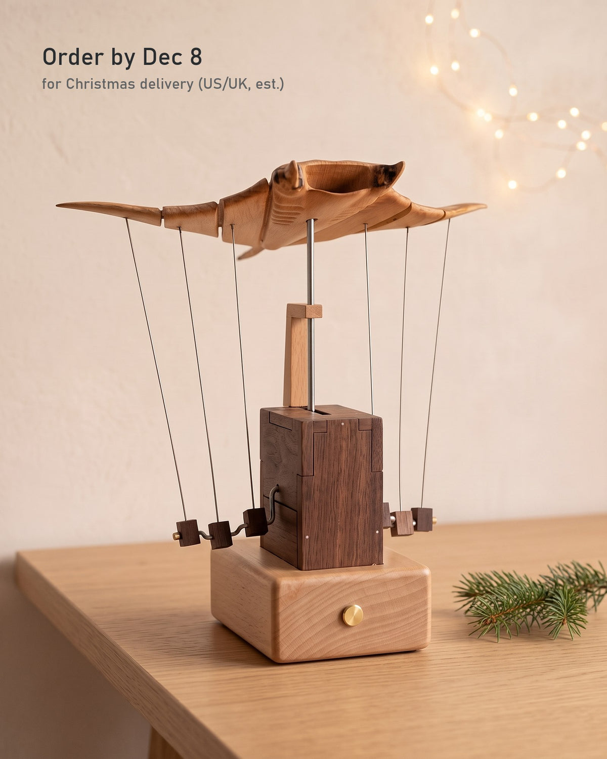 Wooden manta ray with a pine sprig and soft fairy lights. Order by Dec 8 for Christmas delivery (US/UK, est.)