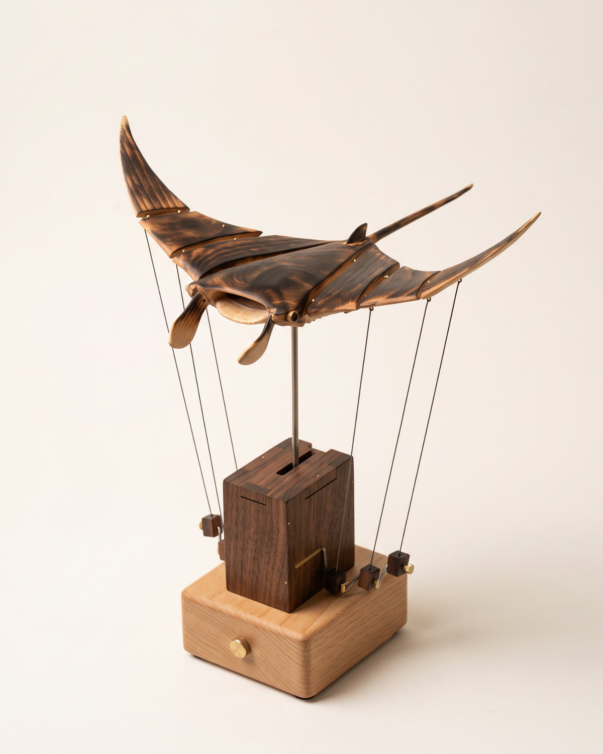 Wooden manta ray automaton, walnut column on a beech base, wings spread