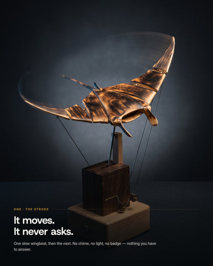 The manta ray mid-downstroke, wingtips blurred by the motion