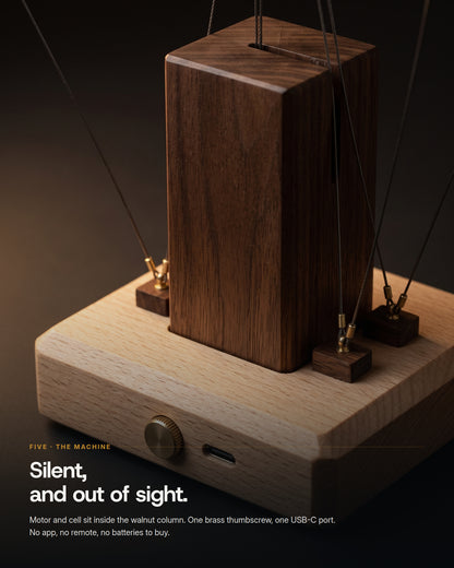 The base: brass thumbscrew and USB-C port in the beech, walnut column above