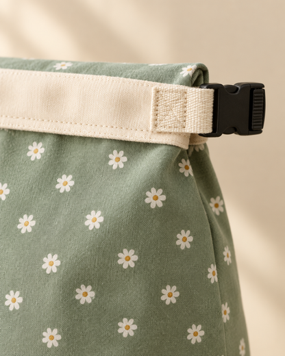 Close-up of the cream webbing tab and black side-release buckle