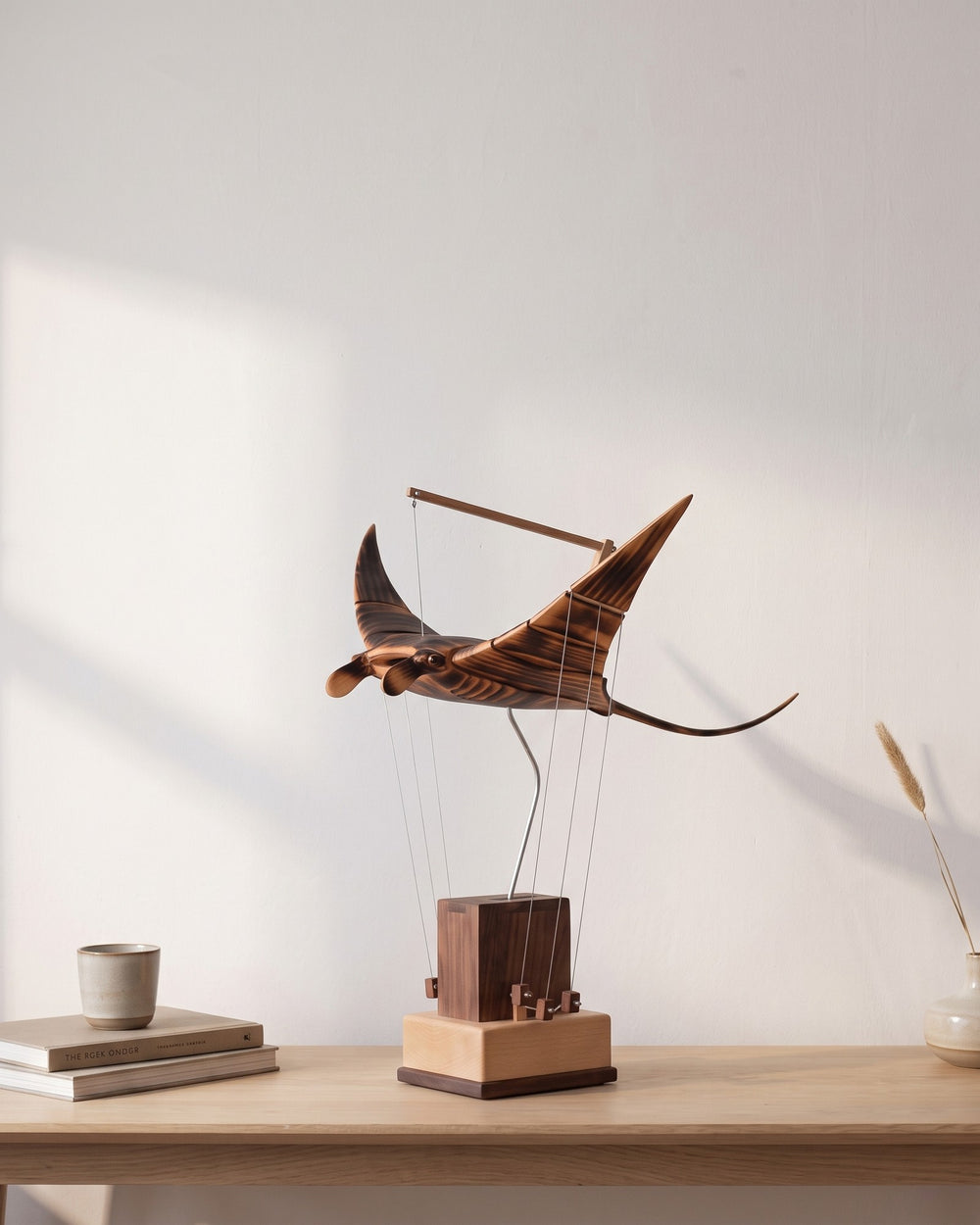 The manta ray automaton on a console table in afternoon daylight
