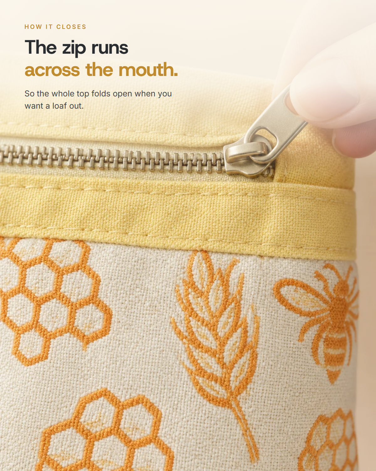 The zip runs across the mouth, so the whole top folds open