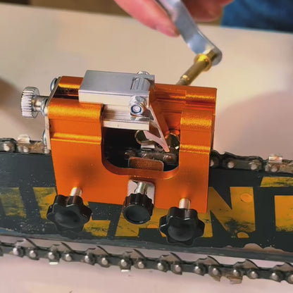 Hand crank chainsaw sharpener clamped on the bar, sharpening chain teeth