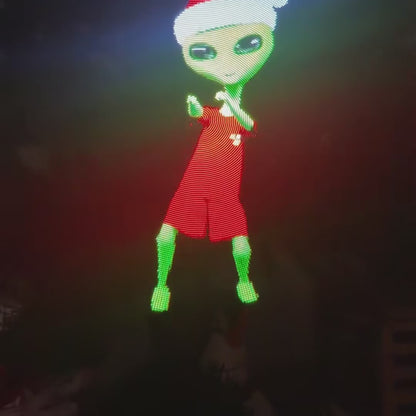 Video: a hologram fan by a real Christmas tree plays a dancing character in a Santa hat