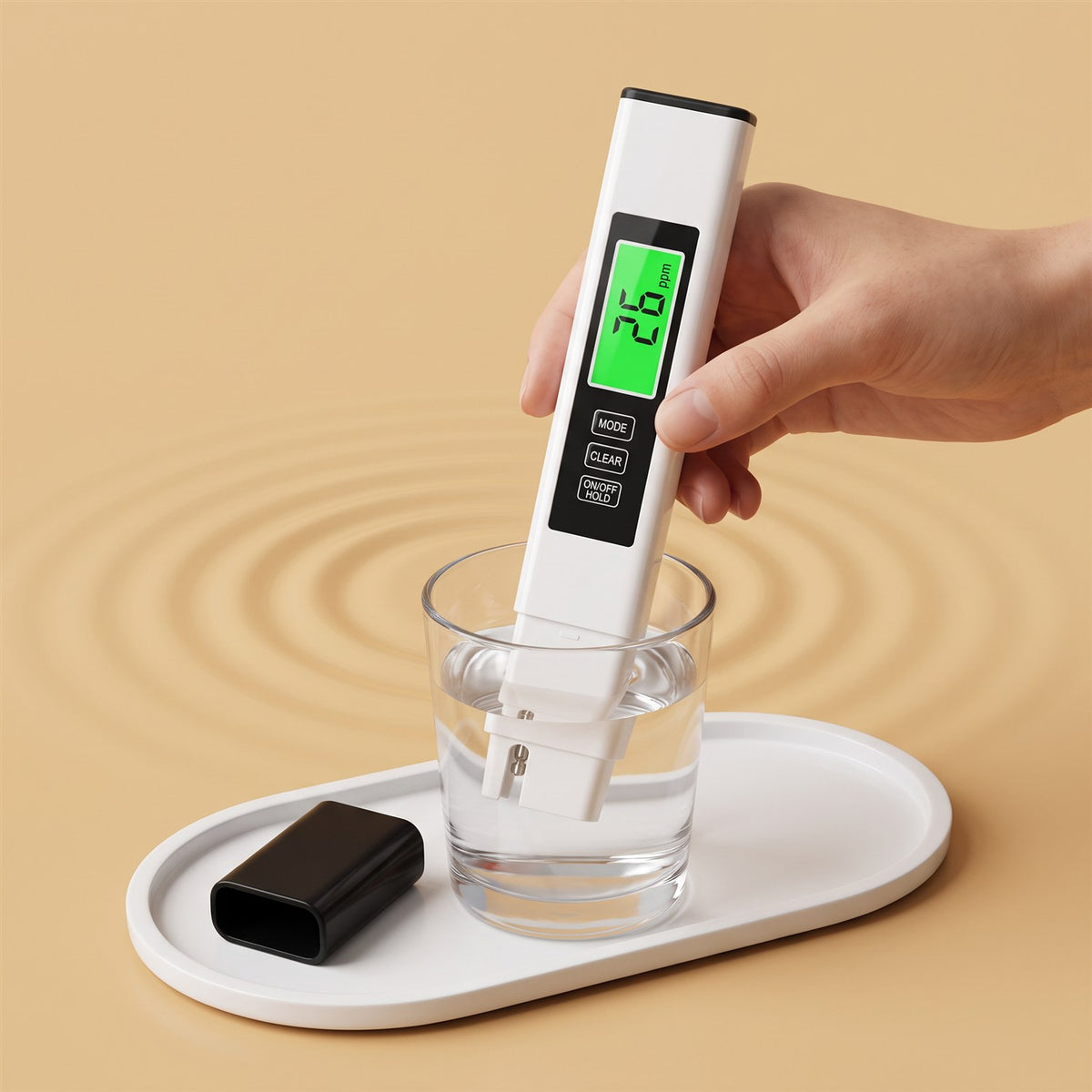 Water tester pen dipped in a glass, green screen reading 26 ppm