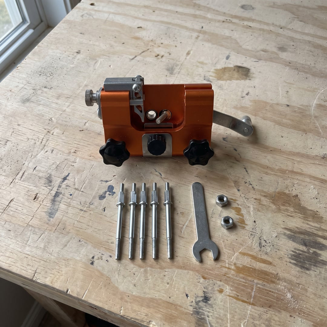 In the box: TrueTooth sharpener with crank, 5 grinding heads, wrench and 2 nuts