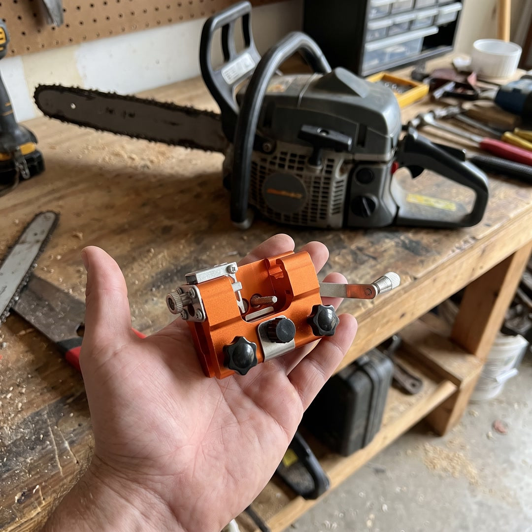 Compact TrueTooth chainsaw sharpener held in one hand