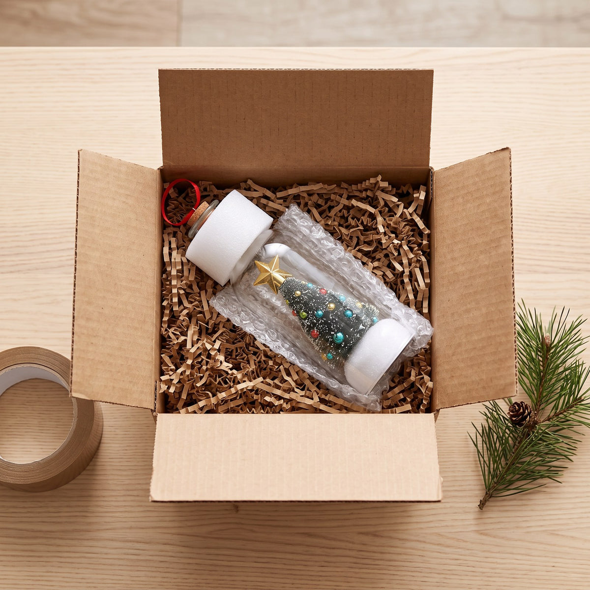 A Voice Bottle packed in bubble wrap and crinkle paper